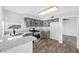 Well-lit kitchen with sleek countertops, modern appliances, and hardwood flooring at 3329 Buffalo Narrows Cir, Las Vegas, NV 89129