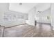 Open-concept living area boasts hardwood floors, natural light, and a cozy fireplace at 3329 Buffalo Narrows Cir, Las Vegas, NV 89129