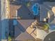 Bird's eye view of home featuring a kidney shaped pool surrounded by mature desert landscaping at 3439 Cottage Canyon St, Laughlin, NV 89029