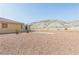 Wide-open backyard offering desert landscaping and beautiful mountain views at 3439 Cottage Canyon St, Laughlin, NV 89029