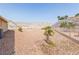A backyard featuring desert landscaping, mountain views, and space for outdoor activities at 3439 Cottage Canyon St, Laughlin, NV 89029