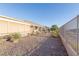 Expansive desert-landscaped backyard with covered patio and desert views at 3439 Cottage Canyon St, Laughlin, NV 89029
