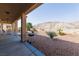 Covered patio with outdoor seating and backyard views at 3439 Cottage Canyon St, Laughlin, NV 89029