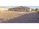 Large desert-landscaped backyard with room for outdoor activities and relaxation at 3439 Cottage Canyon St, Laughlin, NV 89029