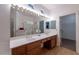 Bathroom featuring dual sinks, and large mirror at 3439 Cottage Canyon St, Laughlin, NV 89029