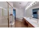 Bathroom featuring a soaking tub, dual sinks, and walk-in shower at 3439 Cottage Canyon St, Laughlin, NV 89029