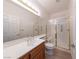 Well-lit bathroom with a spacious shower stall featuring glass doors and grab bars at 3439 Cottage Canyon St, Laughlin, NV 89029
