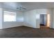 Bright bedroom with a ceiling fan, large window, and carpet at 3439 Cottage Canyon St, Laughlin, NV 89029