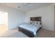 Cozy bedroom features plush carpet, a ceiling fan, and a comfortable bed with storage drawers at 3439 Cottage Canyon St, Laughlin, NV 89029