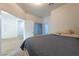 Bedroom with a wood look floor and large opening to the next room featuring natural light at 3439 Cottage Canyon St, Laughlin, NV 89029