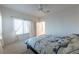 Bright bedroom with natural light, sheer curtains, and neutral carpet offers a serene retreat at 3439 Cottage Canyon St, Laughlin, NV 89029