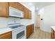 Efficient kitchen features white countertops and modern appliances at 3439 Cottage Canyon St, Laughlin, NV 89029