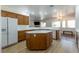 Spacious kitchen featuring an island, white countertops and ample cabinet space at 3439 Cottage Canyon St, Laughlin, NV 89029