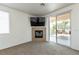 Cozy living room features a fireplace and sliding glass doors to the outdoor space at 3439 Cottage Canyon St, Laughlin, NV 89029