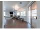 Open-plan living area with fireplace, tile floor, and sliding doors to the outdoor space at 3439 Cottage Canyon St, Laughlin, NV 89029