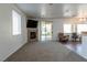 Comfortable living room features plush carpet, fireplace, and an abundance of natural light at 3439 Cottage Canyon St, Laughlin, NV 89029