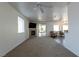 Bright living room with fireplace, ceiling fan and sliding door to backyard at 3439 Cottage Canyon St, Laughlin, NV 89029