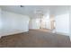 Large living room with a ceiling fan and neutral color palette at 3439 Cottage Canyon St, Laughlin, NV 89029