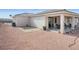 Backyard with desert landscaping, patio, and covered outdoor space at 3491 Cottage Thistle Dr, Laughlin, NV 89029
