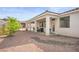 Backyard with covered patio, low-maintenance landscaping, and a neutral color scheme at 3491 Cottage Thistle Dr, Laughlin, NV 89029