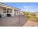 Backyard featuring desert landscaping and a covered patio area perfect for relaxing at 3491 Cottage Thistle Dr, Laughlin, NV 89029