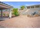 Backyard desert landscape with water feature at 3491 Cottage Thistle Dr, Laughlin, NV 89029