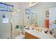 Bright bathroom featuring a gold-framed glass shower and vanity with elegant gold hardware and white countertop at 3491 Cottage Thistle Dr, Laughlin, NV 89029
