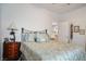 Cozy bedroom featuring a decorative dresser, a queen size bed and views to an open doorway at 3491 Cottage Thistle Dr, Laughlin, NV 89029
