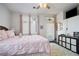 Comfortable bedroom with a queen size bed, wood-look floors, plush rug and a television at 3491 Cottage Thistle Dr, Laughlin, NV 89029