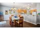 Charming dining area with a stylish chandelier and views of the adjacent kitchen at 3491 Cottage Thistle Dr, Laughlin, NV 89029
