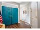 Inviting foyer featuring sleek wood floors and striking blue double doors at 3491 Cottage Thistle Dr, Laughlin, NV 89029