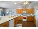 Well-appointed kitchen with white countertops and bright wooden cabinetry at 3491 Cottage Thistle Dr, Laughlin, NV 89029