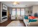 Cozy living room with large windows that provides natural light and comfortable seating at 3491 Cottage Thistle Dr, Laughlin, NV 89029
