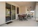 Covered patio with dining set, perfect for outdoor entertaining and relaxation at 3491 Cottage Thistle Dr, Laughlin, NV 89029