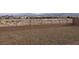 Fenced-in backyard has gravel, a block wall, and views of other houses at 3530 E Moffat Ave, Pahrump, NV 89061