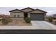 Charming single-story home with a two-car garage and low-maintenance desert landscaping at 3530 E Moffat Ave, Pahrump, NV 89061