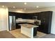 Modern kitchen with stainless steel appliances, granite countertops, and ample cabinet space at 3530 E Moffat Ave, Pahrump, NV 89061