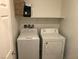 Laundry room featuring a shelf and washer and dryer at 3530 E Moffat Ave, Pahrump, NV 89061