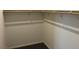 An empty walk-in closet with a clothes rod at 3530 E Moffat Ave, Pahrump, NV 89061