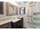 Well-lit bathroom featuring a marble countertop, vanity, and decorative accents at 3843 Desert Marina Dr # 232, Laughlin, NV 89029