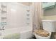 Clean bathroom features a white tub with shower and a toilet with decorative seat at 3843 Desert Marina Dr # 232, Laughlin, NV 89029
