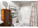 Clean bathroom showcasing a bathtub with shower, organized shelving, and a modern toilet at 3843 Desert Marina Dr # 232, Laughlin, NV 89029