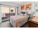 Brightly lit bedroom featuring a large window to a balcony and modern decor at 3843 Desert Marina Dr # 232, Laughlin, NV 89029