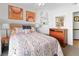 Bright bedroom featuring a ceiling fan, stylish bedspread, and dresser at 3843 Desert Marina Dr # 232, Laughlin, NV 89029