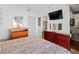 Bedroom featuring hardwood flooring, a dresser, and a mounted television at 3843 Desert Marina Dr # 232, Laughlin, NV 89029