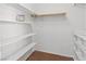 Walk-in closet featuring white shelving units and a clothing rack at 3843 Desert Marina Dr # 232, Laughlin, NV 89029