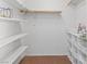 Walk-in closet featuring white shelving units and a clothing rack at 3843 Desert Marina Dr # 232, Laughlin, NV 89029
