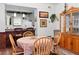 Cozy dining area features natural light and a beautiful wooden china cabinet at 3843 Desert Marina Dr # 232, Laughlin, NV 89029