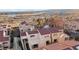 View of multi-story townhomes with balconies, red tile roofs, and desert views at 3843 Desert Marina Dr # 232, Laughlin, NV 89029