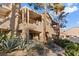 Stylish condo with stucco exterior, private balconies, and desert landscaping at 3843 Desert Marina Dr # 232, Laughlin, NV 89029